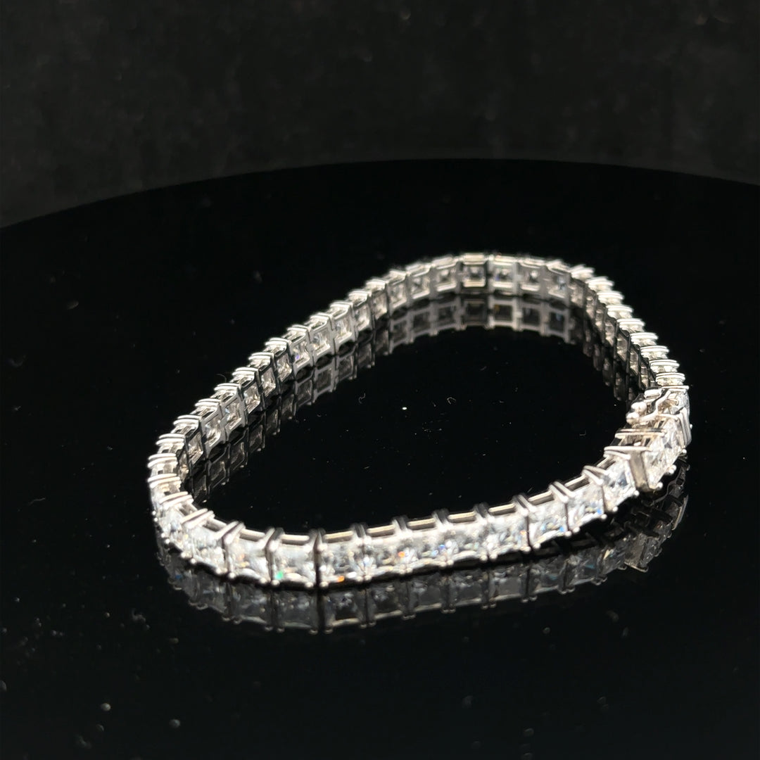 Silver tennis bracelet weighing 15.6g with a sleek design, shown in a close-up image highlighting its fine craftsmanship.