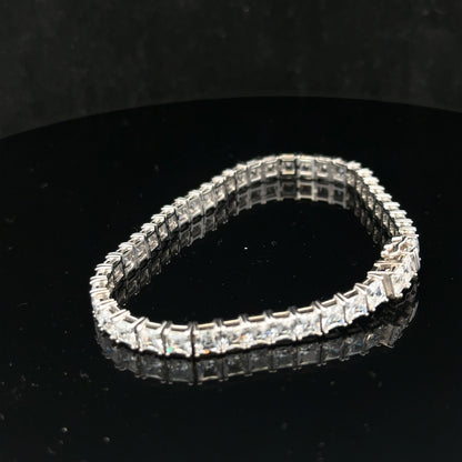 Silver tennis bracelet weighing 15.6g with a sleek design, shown in a close-up image highlighting its fine craftsmanship.