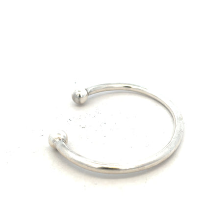 Silver torque bangle 20g, unbranded, featuring a sleek, polished design with a smooth, rounded shape for stylish wrist wear.