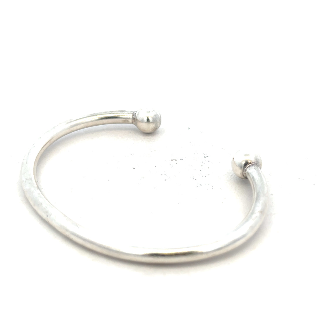 Silver torque bangle 20g, unbranded, with a sleek, polished design perfect for stylish wrist jewelry.