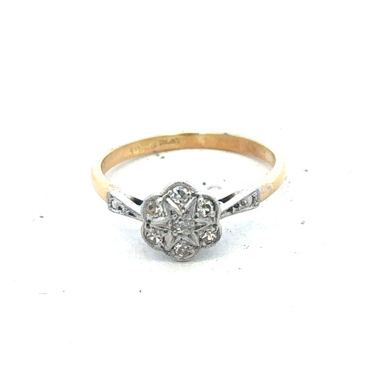 Vintage 18ct yellow gold and platinum diamond ring, showcasing a detailed design and sparkling diamonds.