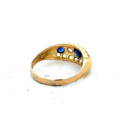 Vintage 18ct yellow gold sapphire and diamond ring with intricate detailing and classic design.